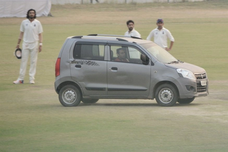 car in cricket groung