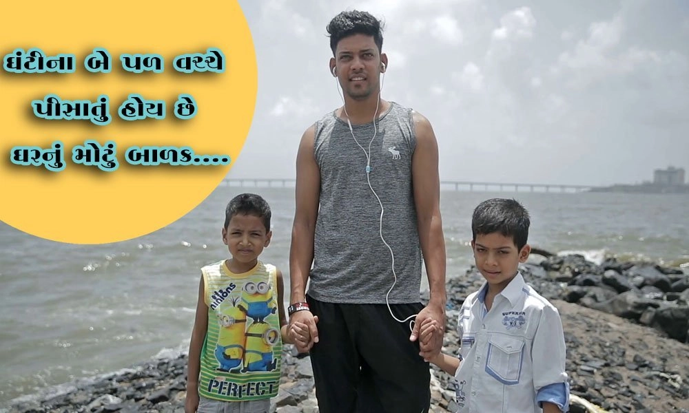 videoblocks an elder brother holding hands of his two young brother while sea waves splashing on rocks in the background mumbai india rc5luvspz thumbnail full01.jpg