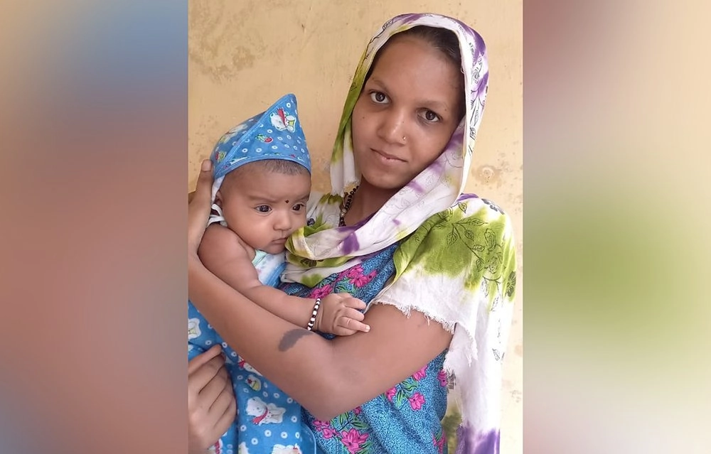 Wahidaben with her baby.jpg