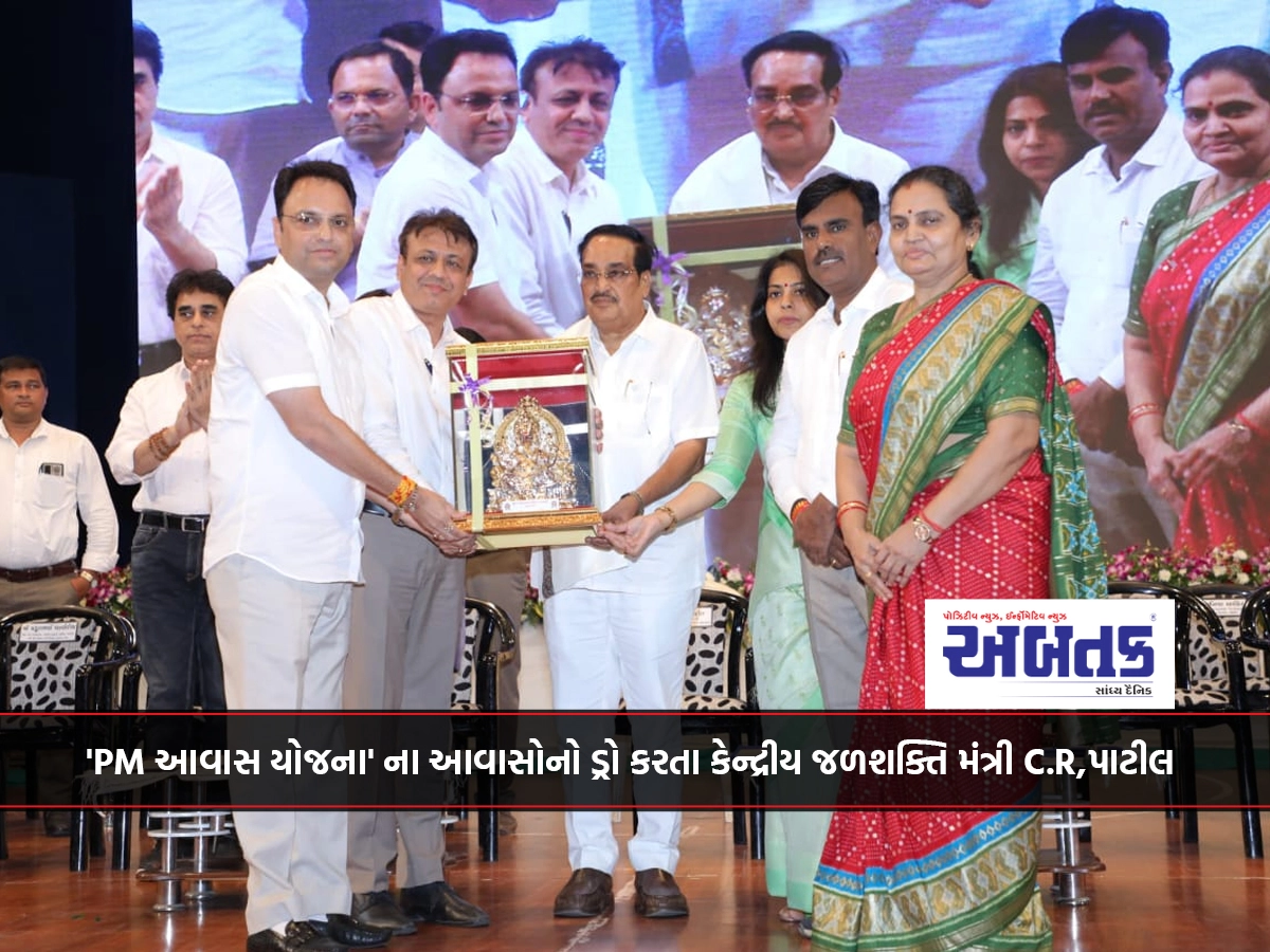 Surat: Union Water Power Minister C.R.Patil drawing the houses of 'PM Awas Yojana'